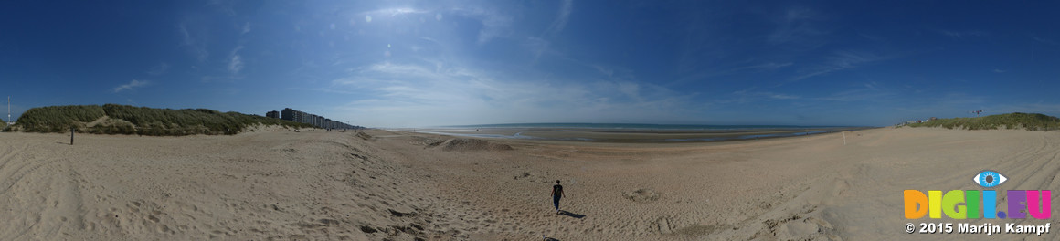 FZ015924-39 Jenni walking on beach at De Panne